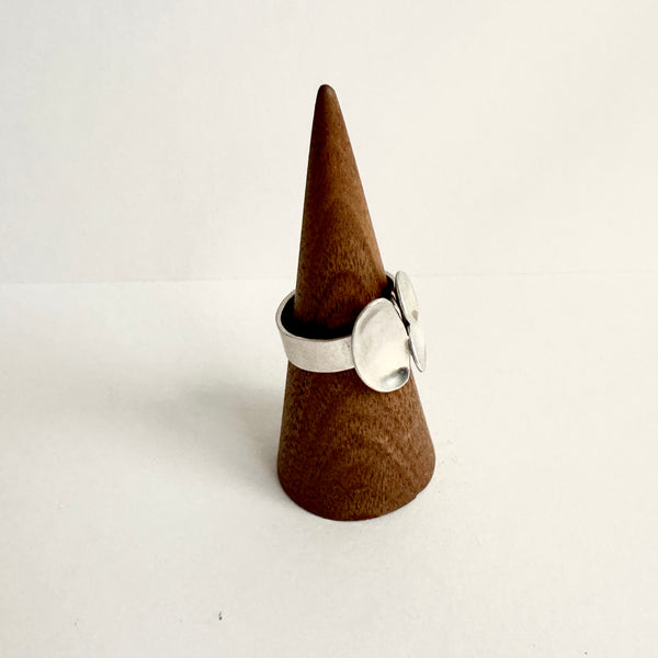 Side view of a triple oval open ring showing soft hammered ring shank. www.wyckoffsmith.com