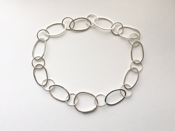 Handmade hammered oval silver chain from modular jewellery Olga Collection.