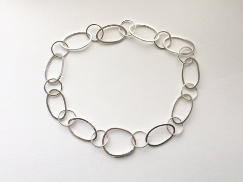 Handmade hammered oval silver chain from modular jewellery Olga Collection.