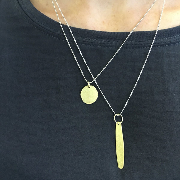 Sample styling of layered textured 18 ct gold pendants on silver chains by Wyckoff Smith Jewellery. www.wyckoffsmith.com