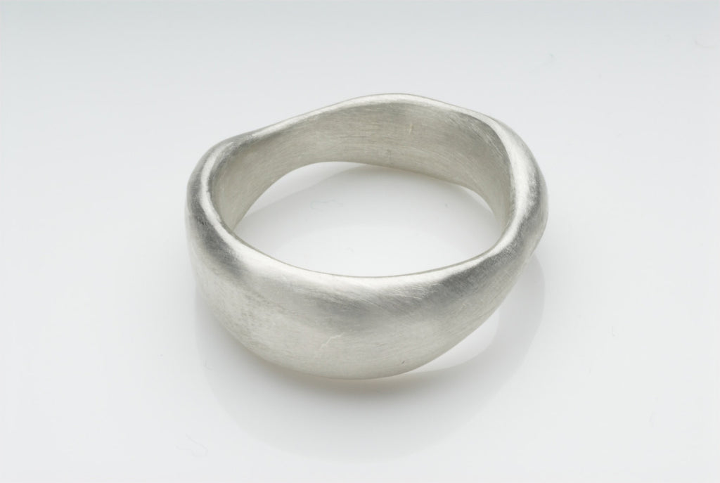Organic shaped chunky wide wedding band.