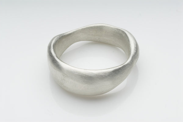 Organic shaped chunky wide wedding band.