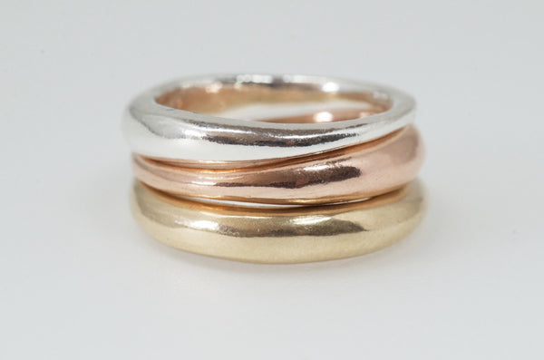 Modern stacking wedding rings in silver, rose gold and yellow gold.