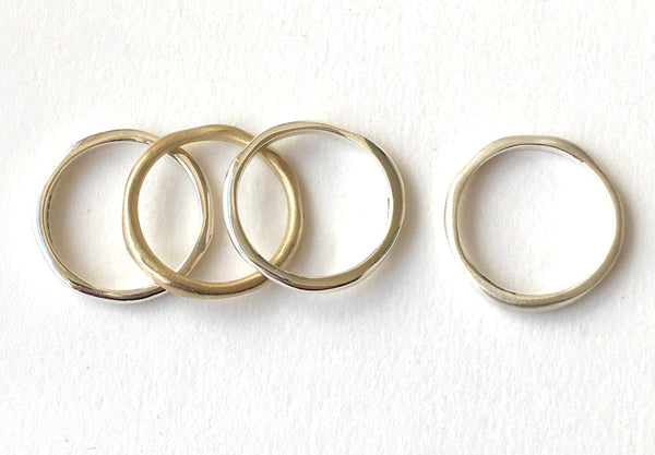 Organic shaped stacking silver and gold rings by Wyckoff Smith Jewellery