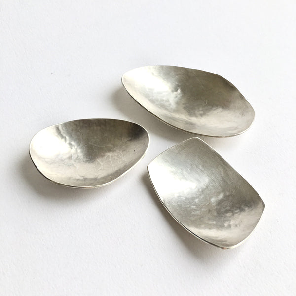 Assortment of organic shaped silver tea caddy spoons by Michele Wyckoff Smith Jewellery. www.wyckoffsmith.com