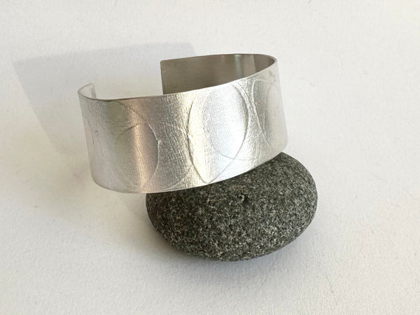 Oval leaf textured matte wide silver cuff on black pebble - www.wyckoffsmith.com