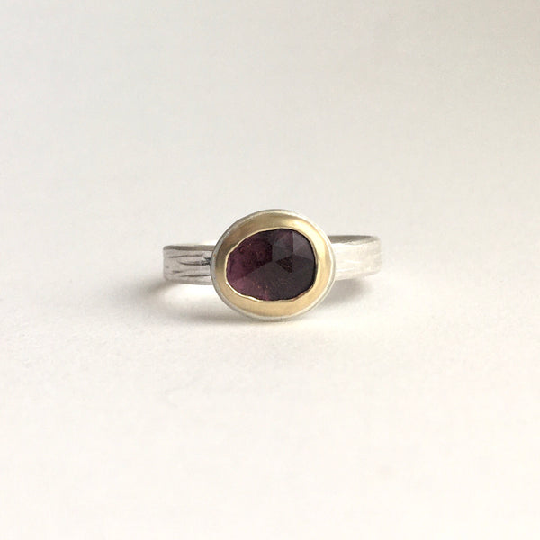 Front view of pink rose cut tourmaline set in 18 ct gold on a textured silver band on www.wyckoffsmith.com