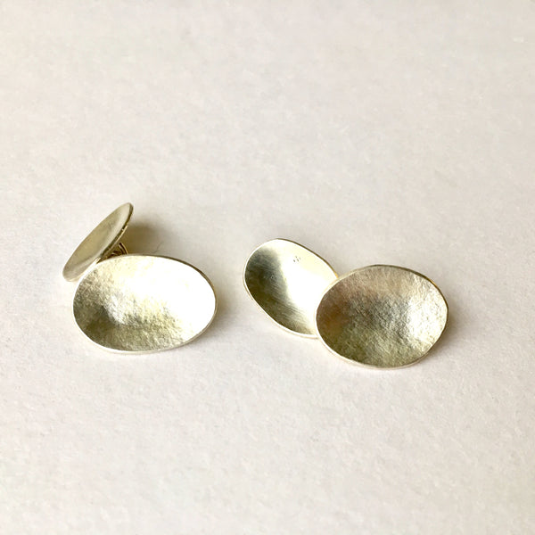 Oval silver cuff links by Michele Wyckoff Smith.