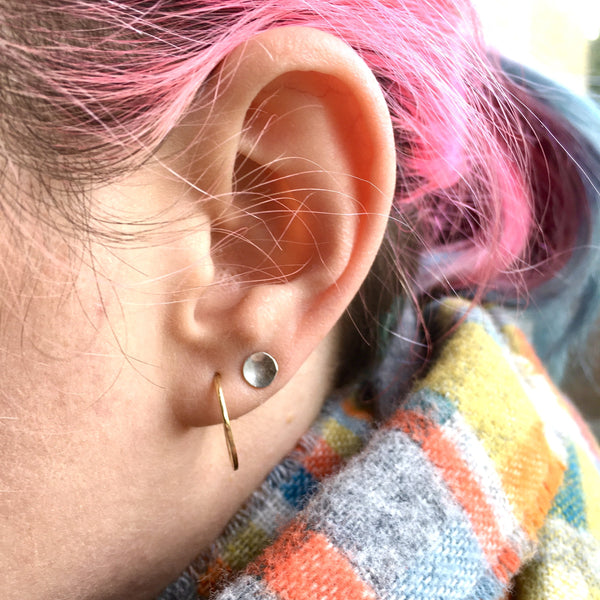 14 ct gold hammered hoop with silver round stud and pink hair on model by Wyckoff Smith Jewellery.