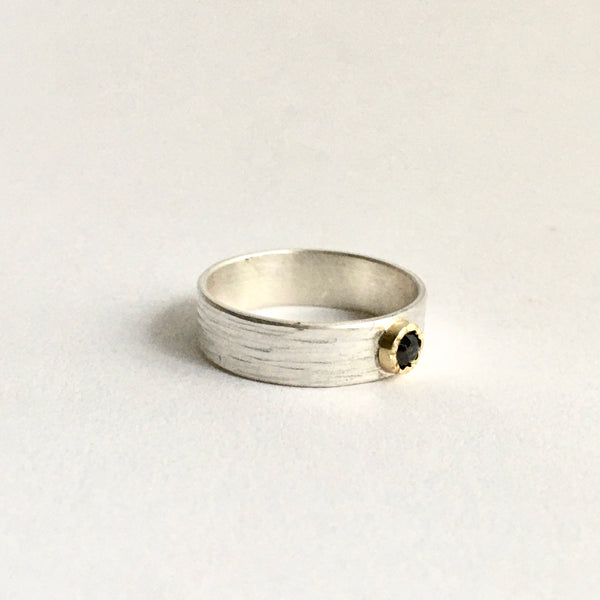 Side view of rose cut cognac diamond in 18 ct gold hammer setting on a wide silver band - www.wyckoffsmith.com