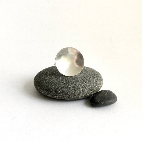Front view of circular concave statement ring on pebble - www.wyckoffsmith.com - matte circle full moon ring
