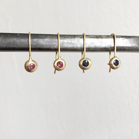 Ruby and sapphire dangle drop recycled 18 ct gold earrings on a steel bar - www.wyckoffsmith.com - gold hook earrings set with stones
