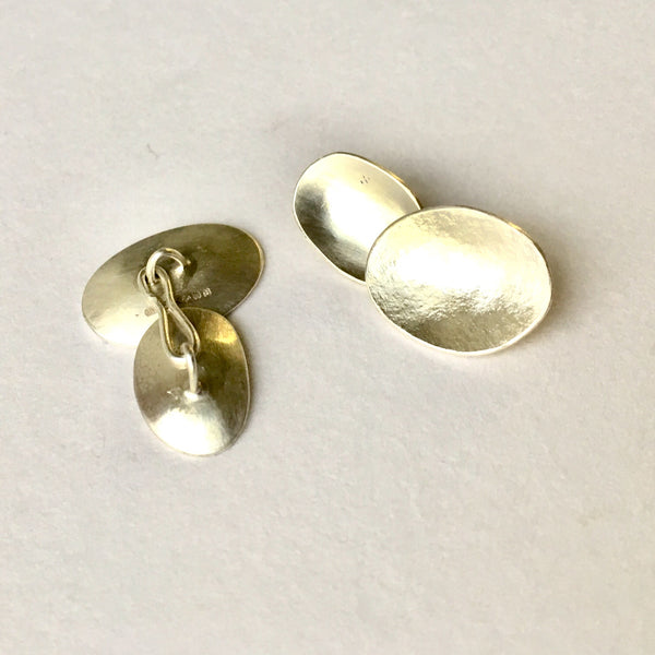 Silver cufflinks for women by Michele Wyckoff Smith.
