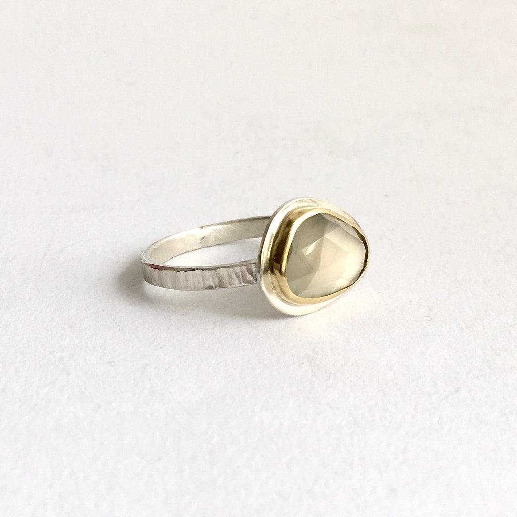 Side view of grey moonstone set in 18 ct gold with hammered ring shank - www.wyckoffsmith.com