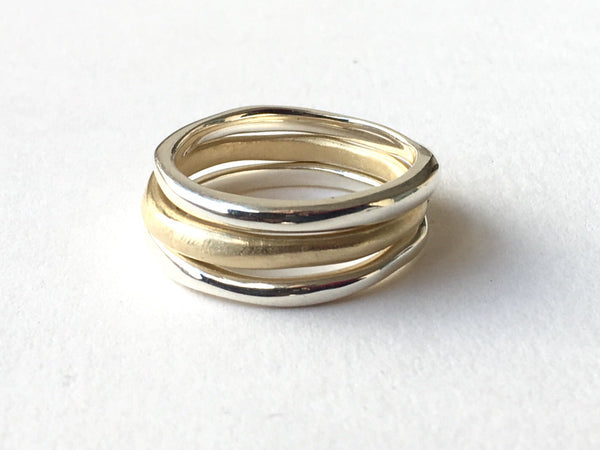 Stacking organic shaped silver and gold bands by Michele Wyckoff Smith 