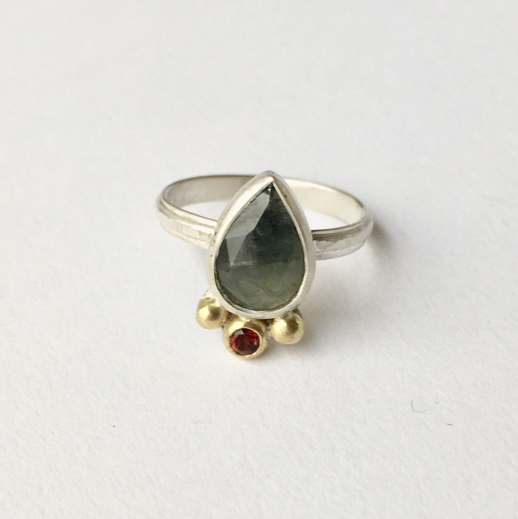 Two tone blue and green faceted sapphire with hammer textured ring shank by Michele Wyckoff Smith