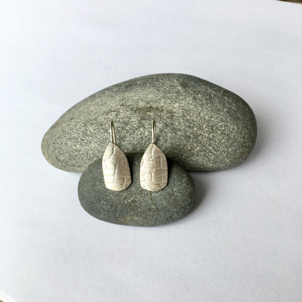 Overall irregular grid texture on silver spinnaker dangle earrings (option 3) on www.wyckoffsmith.com