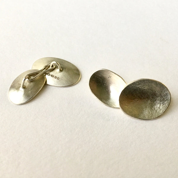 Unisex silver cuff links by Michele Wyckoff Smith.