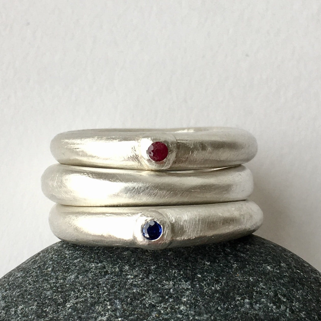 Chunky men's ruby engagement ring with organic shaped wedding ring by Michele Wyckoff Smith Jewellery.