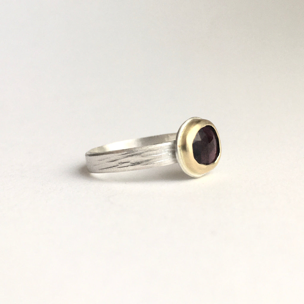 Side view of deep pink rose cut tourmaline set in 18 ct gold on textured silver band by Michele Wyckoff Smith on www.wyckoffsmith.com