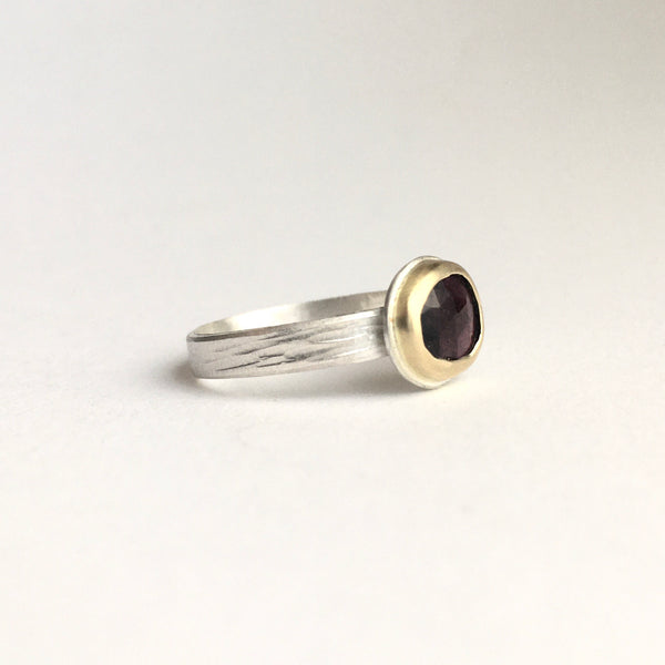 Side view of deep pink rose cut tourmaline set in 18 ct gold on textured silver band by Michele Wyckoff Smith on www.wyckoffsmith.com