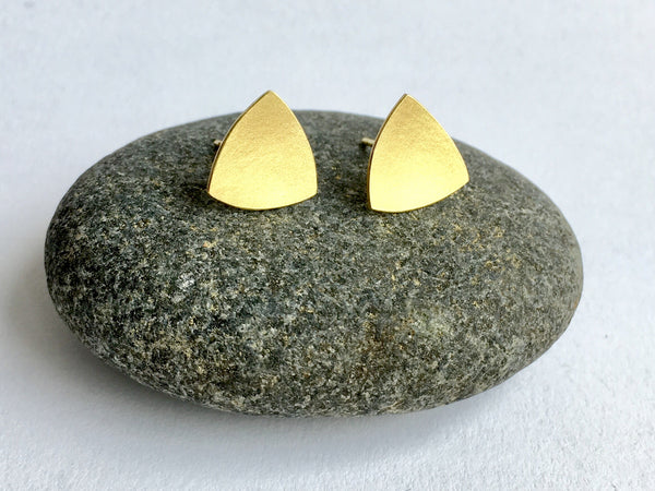 view of a pair of triangle earrings in 18 ct gold by Wyckoff Smith Jewellery