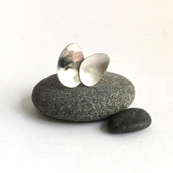 Front view of two textured ovals on an adjustable ring - www.wyckoffsmith.com