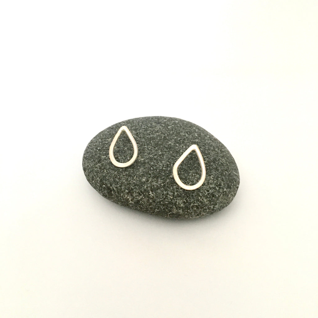 Lightly hammered silver teardrop shaped post earrings on www.wyckoffsmith.com