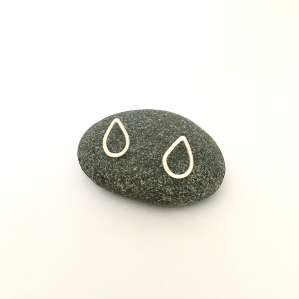 Lightly hammered silver teardrop shaped post earrings on www.wyckoffsmith.com