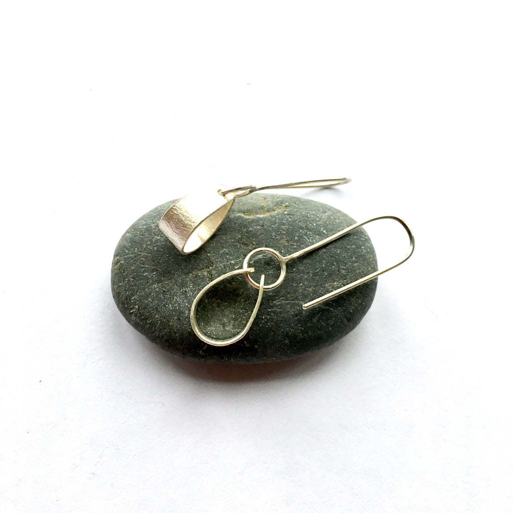 Two angles of the silver Swing Petal Earrings on www.wyckoffsmith.com
