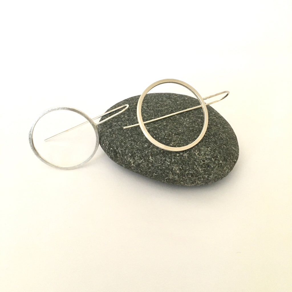 Lightly hammered silver circles with ear wires on www.wyckoffsmith.com