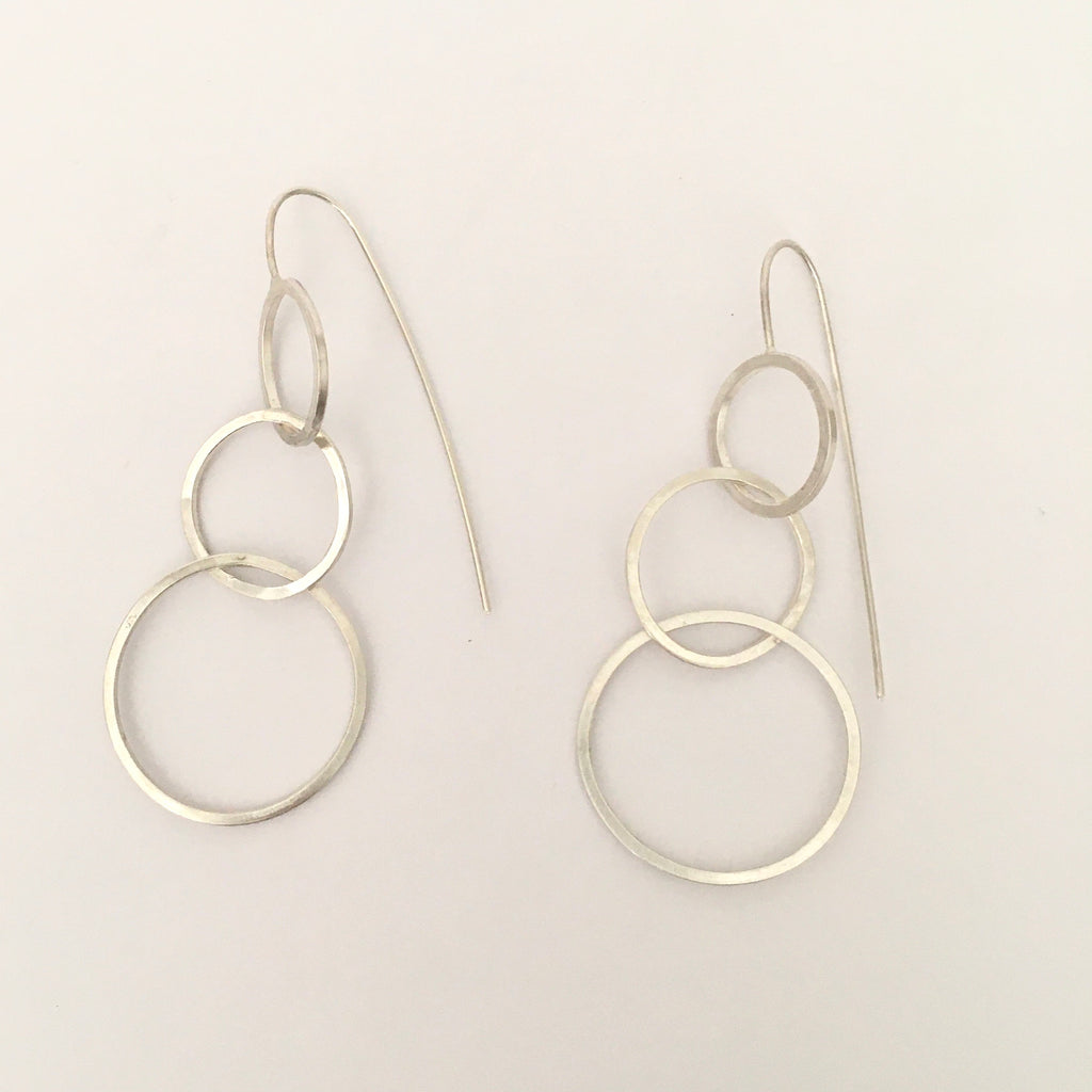 Three intertwined silver circle dangle earrings on www.wyckoffsmith.com