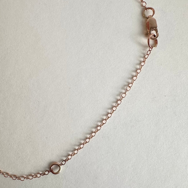 Lobster clasp adjustable 9 ct rose gold trace chain with oval pendant. www.wyckoffsmith.com