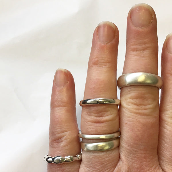 Assorted organic shape silver stacking rings by Michele Wyckoff Smith available on www.wyckoffsmith.com