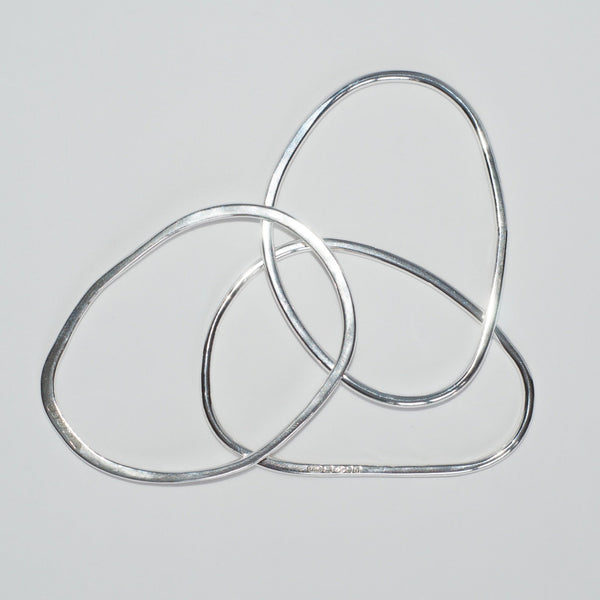 Three oval shaped bangles made by Michele Wyckoff Smith