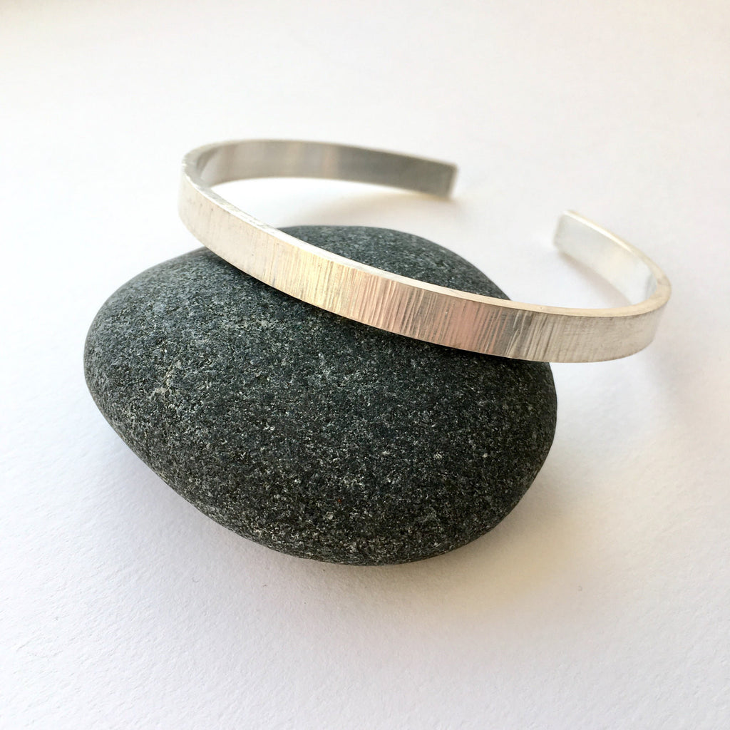 Hammered texture silver open cuff bracelet.