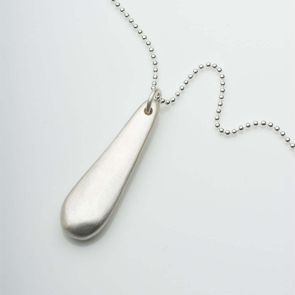 Silver anti anxiety jewelry. Organic shape silver pendant fiddle jewellery by Michele Wyckoff Smith