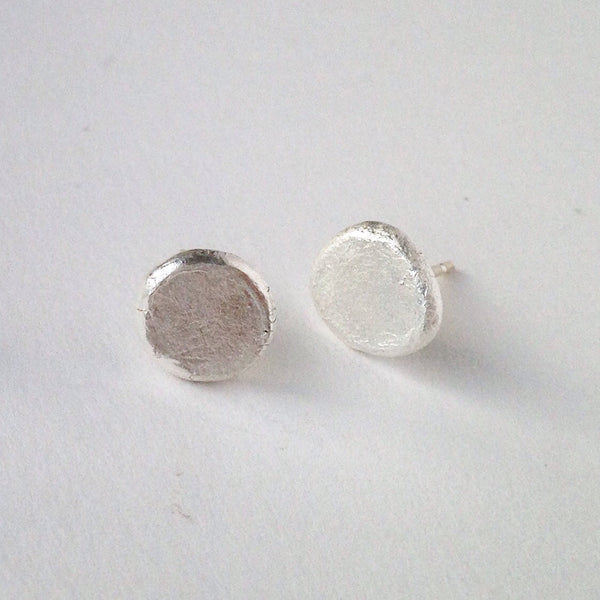 Second view of rough textured silver stud handmade earrings by www.wyckoffsmith.com