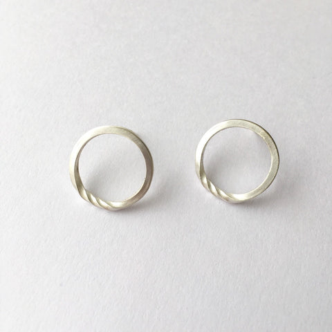 Twisted silver minimalist round stud earrings.