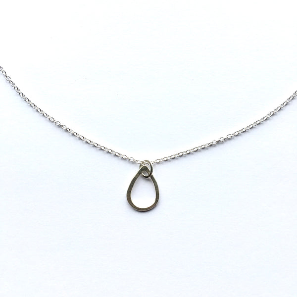 Hammered tear drop silver pendant on adjustable silver chain. www.wyckoffsmith.com