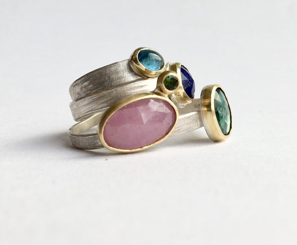 Stack of brightly coloured gemstone stacking rings by Michele Wyckoff Smith