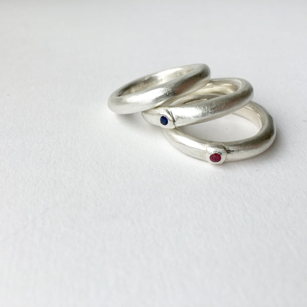 Ruby and sapphire chunky men's engagement rings by Michele Wyckoff Smith.