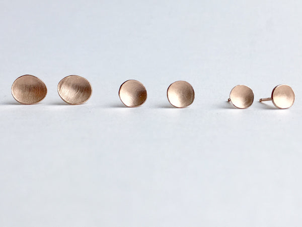 Group photograph of 14 ct rose gold textured and domed earrings by Michele Wyckoff Smith