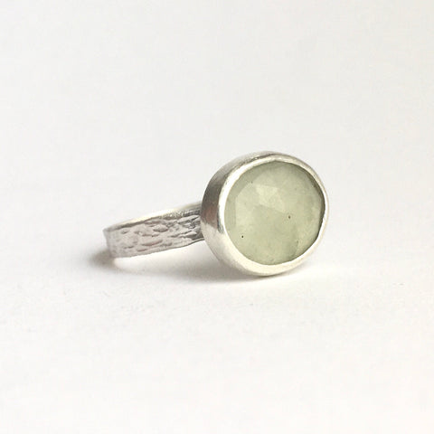 Pale grey green faceted prehnite with textured silver ring shank available on www.wyckoffsmith.com