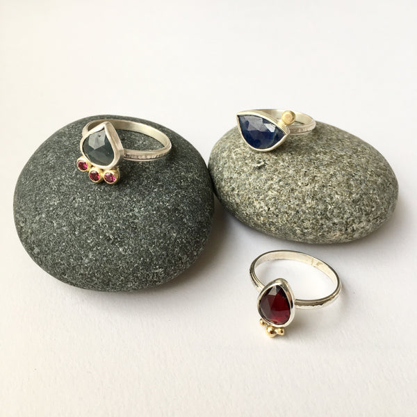 Hand forged silver rings with garnets and sapphires by Michele Wyckoff Smith