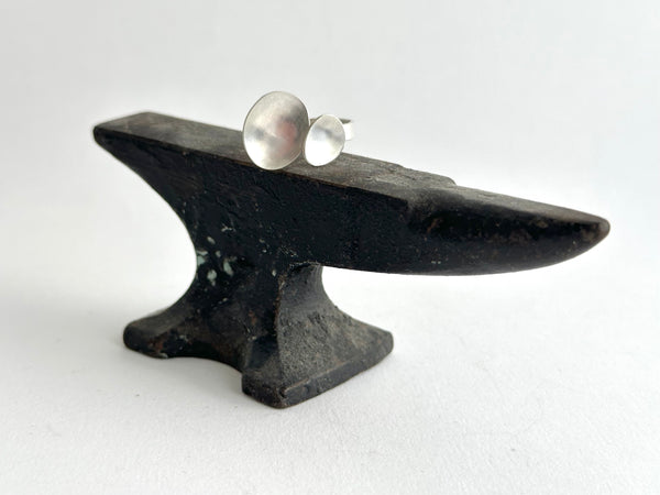 Open and adjustable oval ring - style 6 - on an anvil - www.wyckoffsmith.com