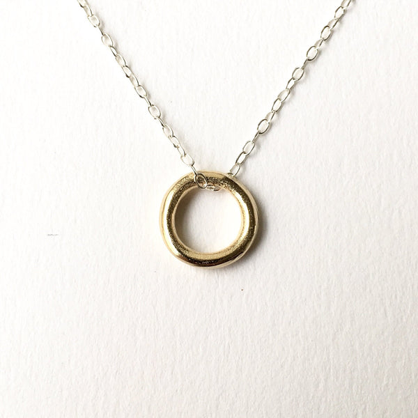 Round Organic Small circle pendant in gold on silver chain by Wyckoff Smith Jewellery. Matching earrings available