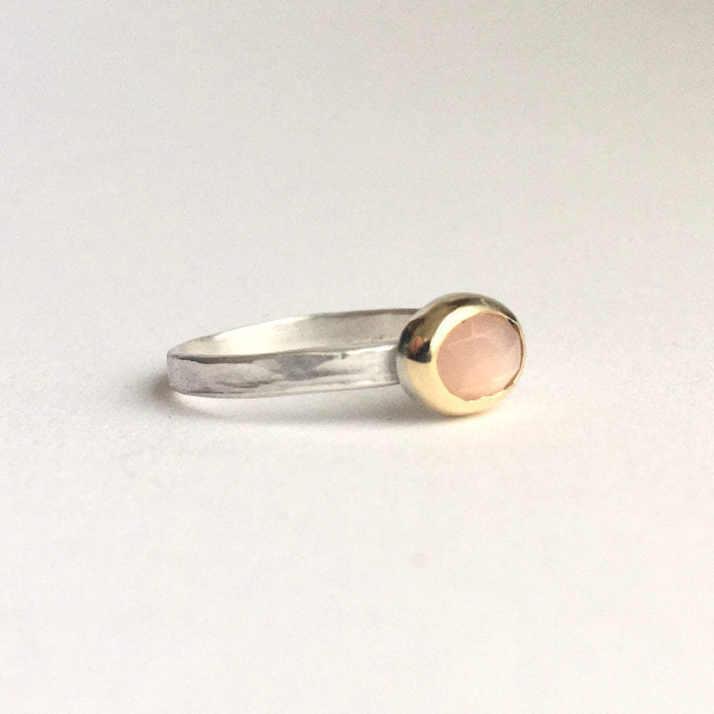 Pale peach faceted moonstone gemstone ring set in 18 ct gold on a silver ring available on www.wyckoffsmith.com