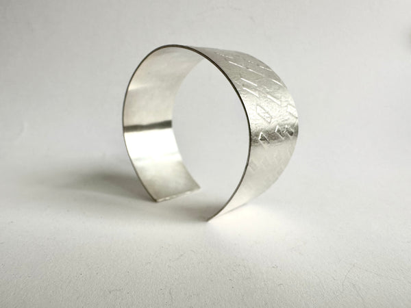 Overview of dash textured 1" wide silver cuff - www.wyckoffsmith.com