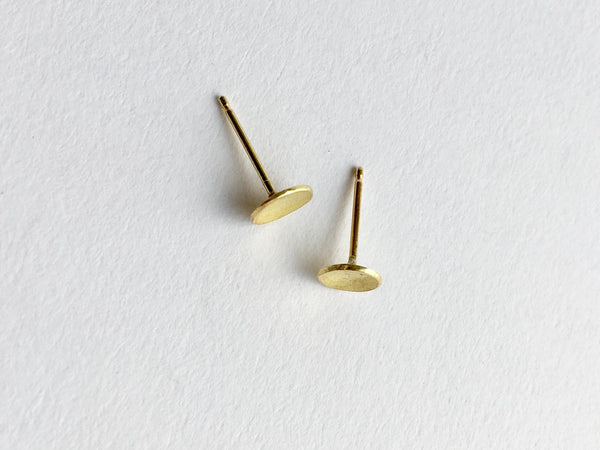 Top view of domed 18 ct gold stud earrings by Wyckoff Smith Jewellery